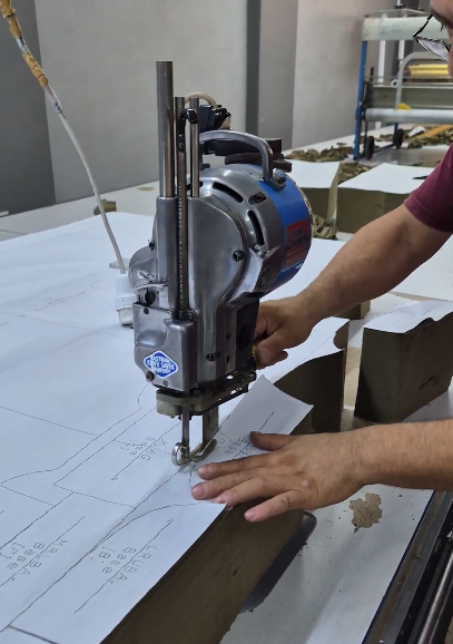 Precision-cutting fabric to pattern in the cutting room